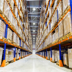 Rows of shelves with boxes in modern warehouse